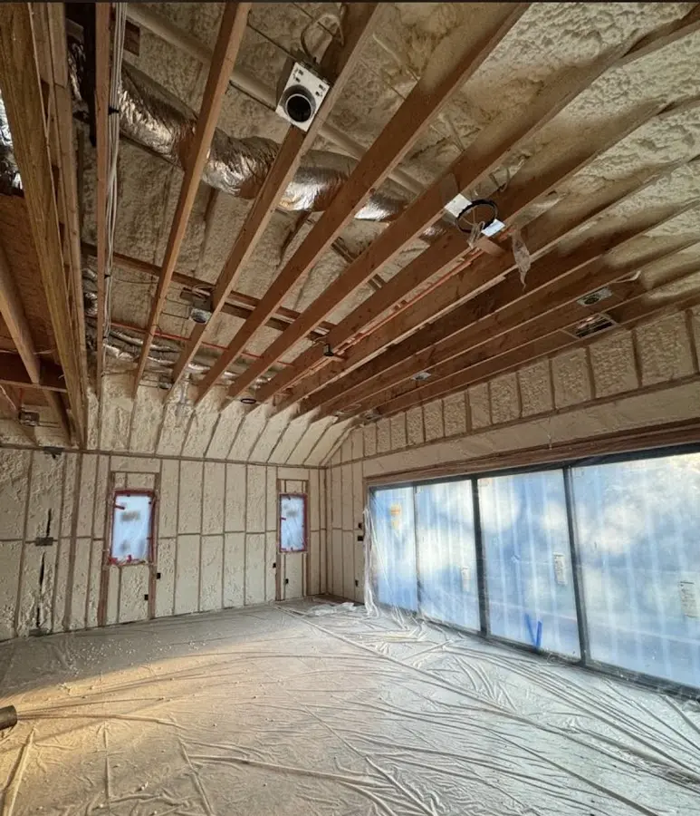 Interior walls and ceiling insulated with spray foam during new construction in West Brandywine